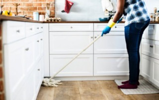 woman cleaning kitchen