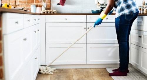 woman cleaning kitchen