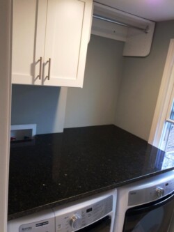 LAUNDRY ROOM WITH GRANITE TOP SHAKER DOORS